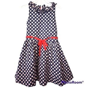 - Savannah girls polka dot dress with tulle underneath and bow detailing